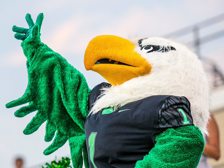 UNT mascot Scrappy waves at a football game