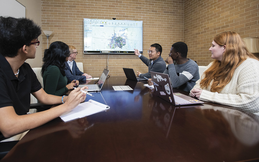 People in meeting with zoning map