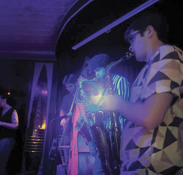 Ian Weidmann performing with saxophone