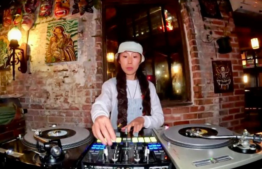 Meng Ren at DJ set up with two turnables