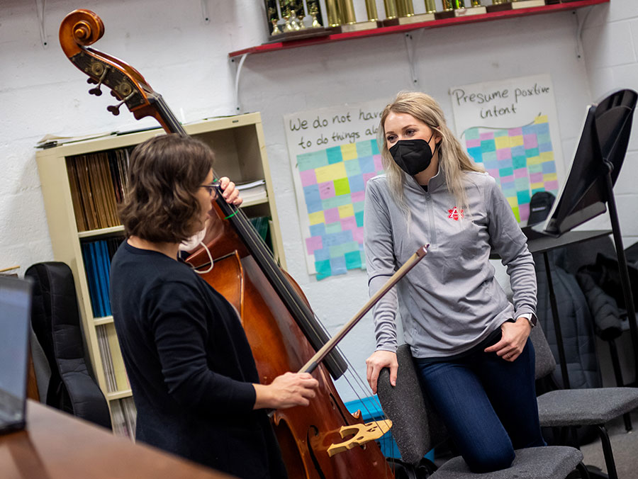 Annie Ray talking with double bass musician
