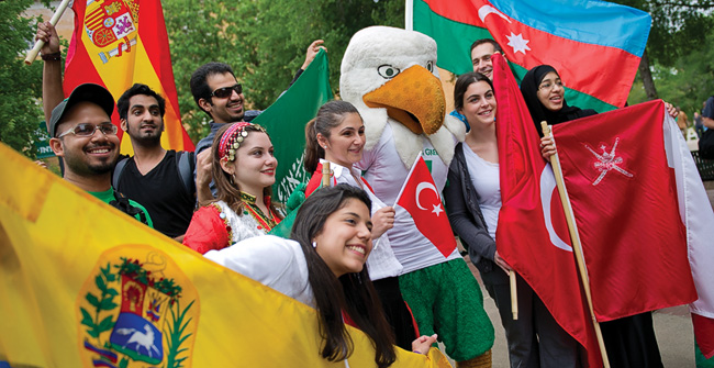 Student groups celebrated with a flag parade on the 51st annual University Day in April, commemorating UNT's transition from a college to a university in 1961. (Photo by Gary Payne)