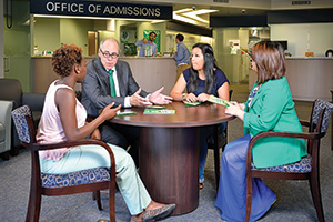 President Neal Smatresk meets with student. (Photo by Michael Clements)