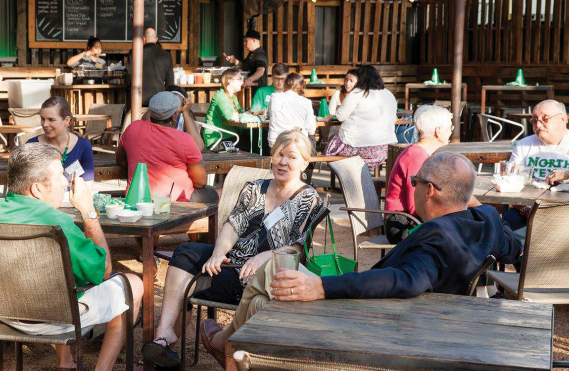 UNT alumni at an outdoor gathering