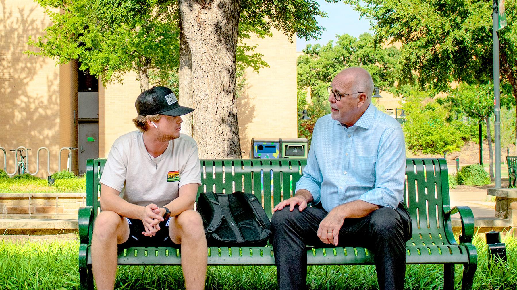UNT President Neal Smatresk chats with a student one on one