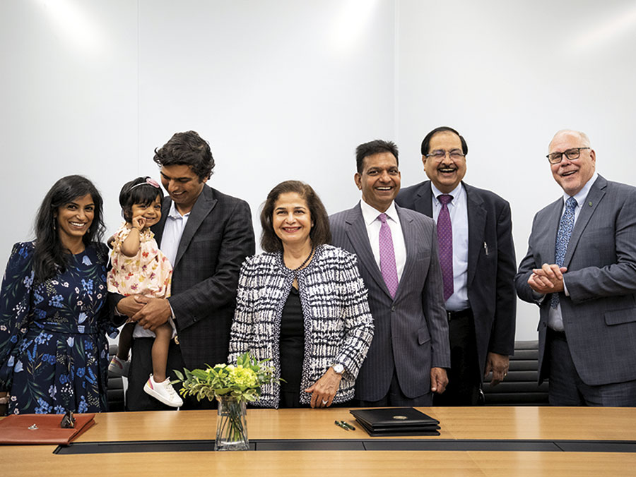 The Gupta family celebrates the new center with President Neal Smatresk.