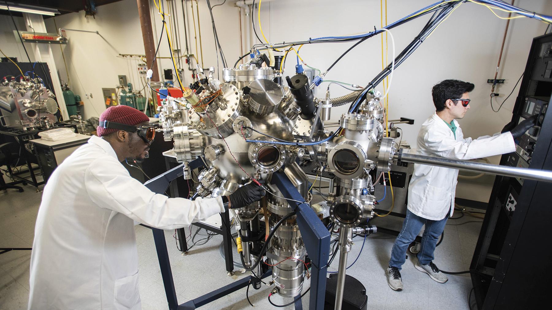 Two students perform semiconductor-related research at UNT's Discovery Park.