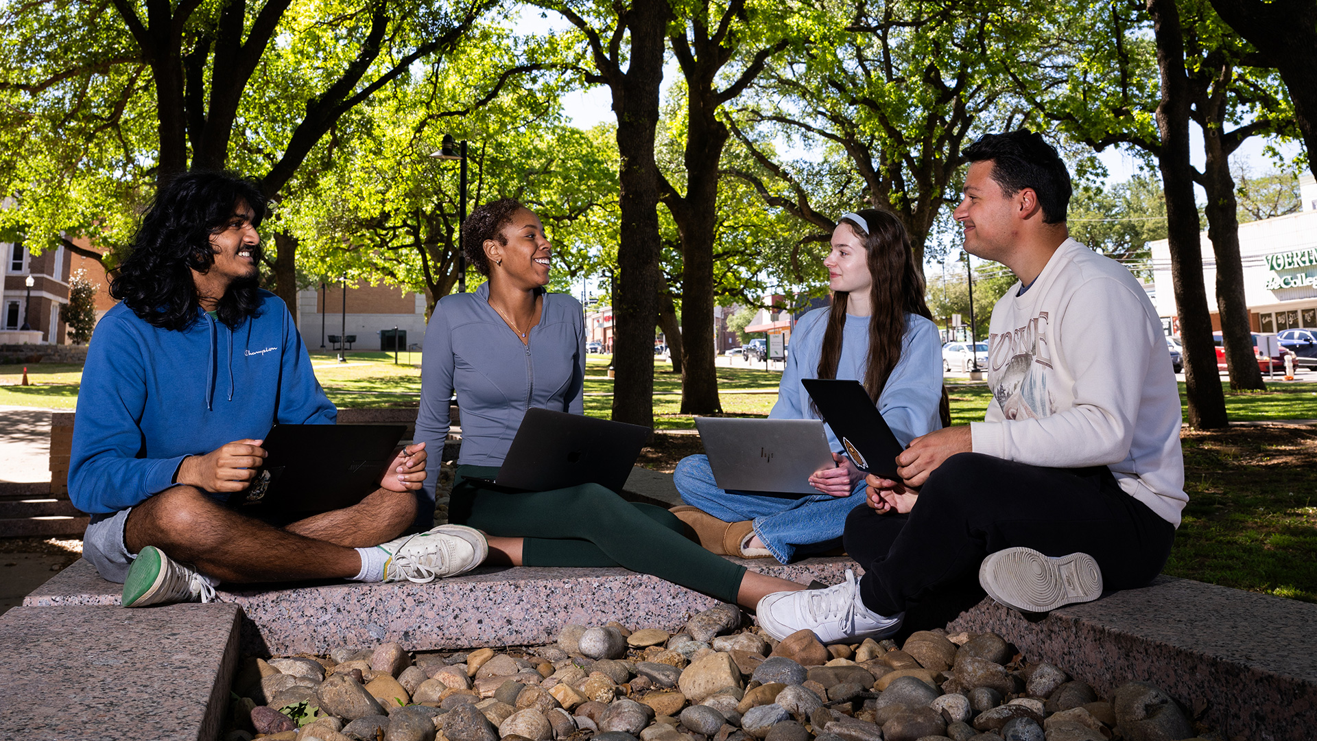 Students and lecturer in an outdoor class setting