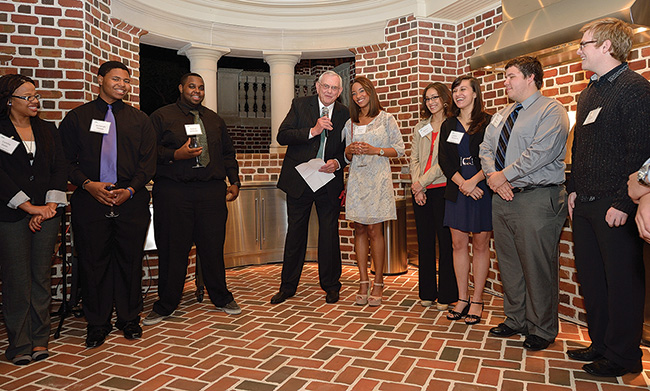 President V. Lane Rawlins, surrounded by Emerald Eagle Scholars, speaks to the crowd at the kickoff event about the importance of the program, which helps academically talented students with high financial need attend college. (Photo by Michael Clements)