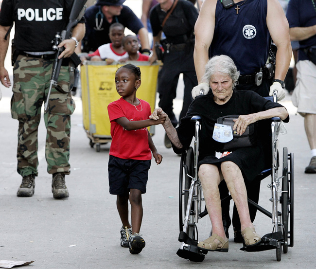 Evacuating from the  convention center in New Orleans after Hurricane Katrina, Sept. 3, 2005