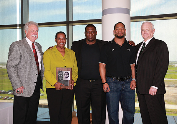 Pictured from left are long jump specialist Ron Linscomb ('66); Pat Chapman, accepting for her late husband, lineman Walter Chapman ('77); lineman Brandon Kennedy; Jamario Thomas ('08), who led the nation in rushing as a freshman; and fullback and Mean Green ambassador C. Dan Smith ('62). (Photo by Rick Yeatts)