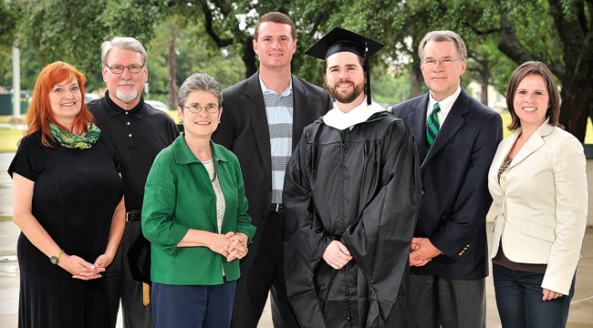 From left, Kristin Williamson, David Williamson, Celia Williamson, Kevin McGill (’07), Sam Williamson (’12 M.A.), Tim Williamson (’85 M.S.), Emily Williamson McGill (’06, ’08 M.P.A.)  (Photo by Jonathan Reynolds)