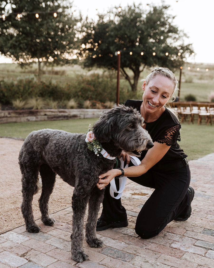 Amy Fiala with dog at wedding