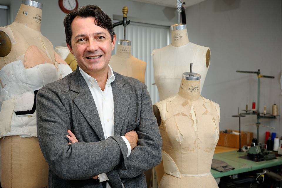 Michael Faircloth in front of dress forms