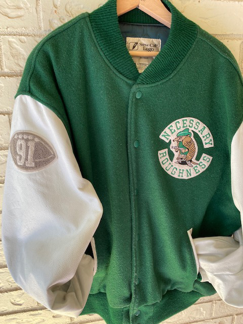 Necessary Roughness letter jacket given to the players and mascot during filming