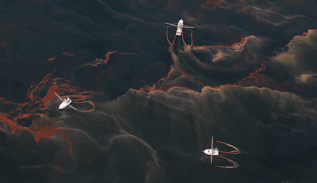 Shrimp boats collecting oil in the waters of Chandeleur Sound, La., May 5, 2010