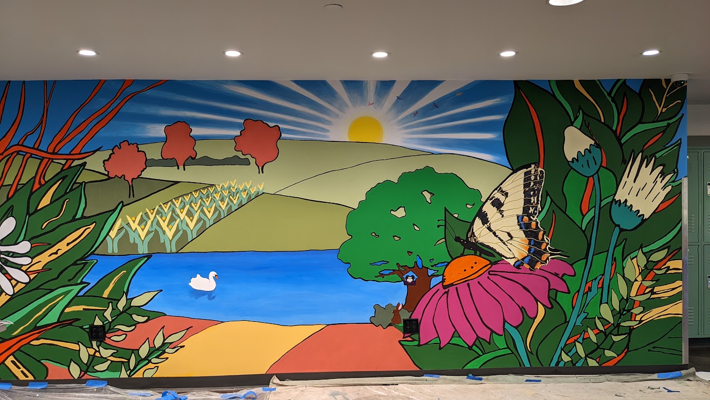 A mural titled 'A New Day' was designed and painted by members and volunteers of The Art Room along with Denton community members. The organization donated the artwork in 2022 to Our Daily Bread shelter. Courtesy of The Art Room. 